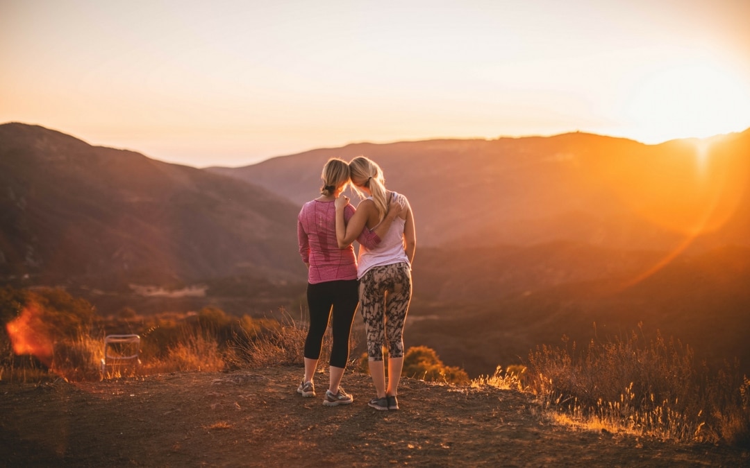 two runners on their transformational travel while working out, Workouts While Traveling: 7 Great Tips for Working Out on Your Transformational Travel